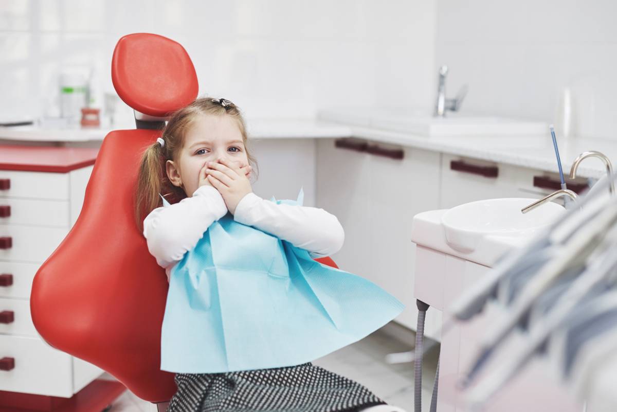 Child with dental anxiety.