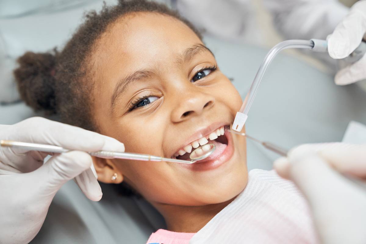 Kid at the dentist smiling